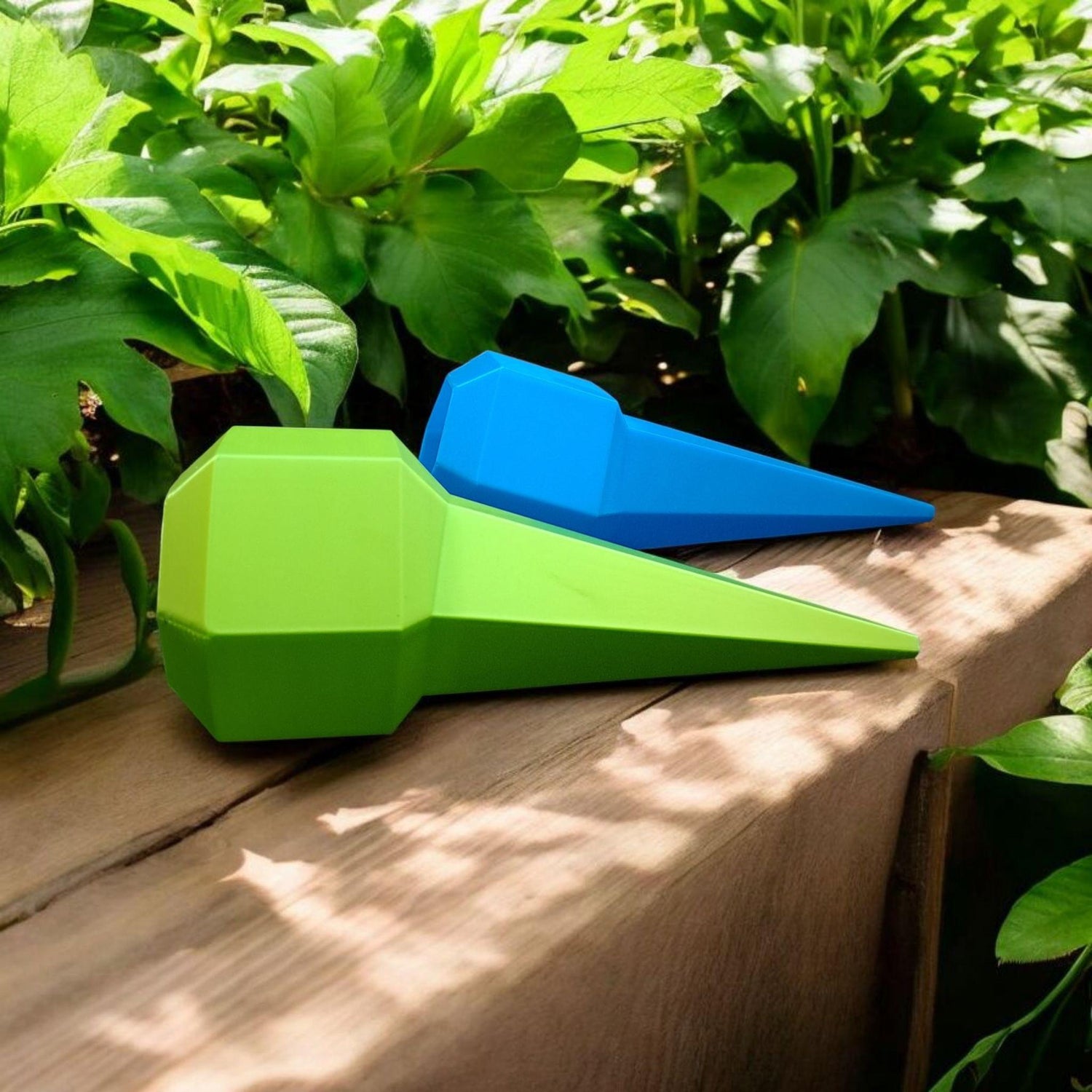 a green and blue covered water spike to inset into plants