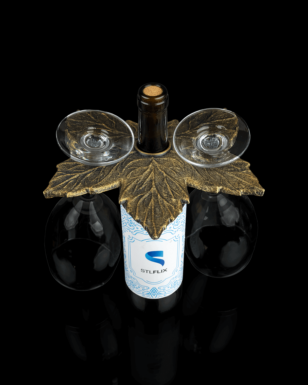 Elegant leaf wine glass holder with wine bottle and glasses, perfect for wine enthusiasts and fall decor.